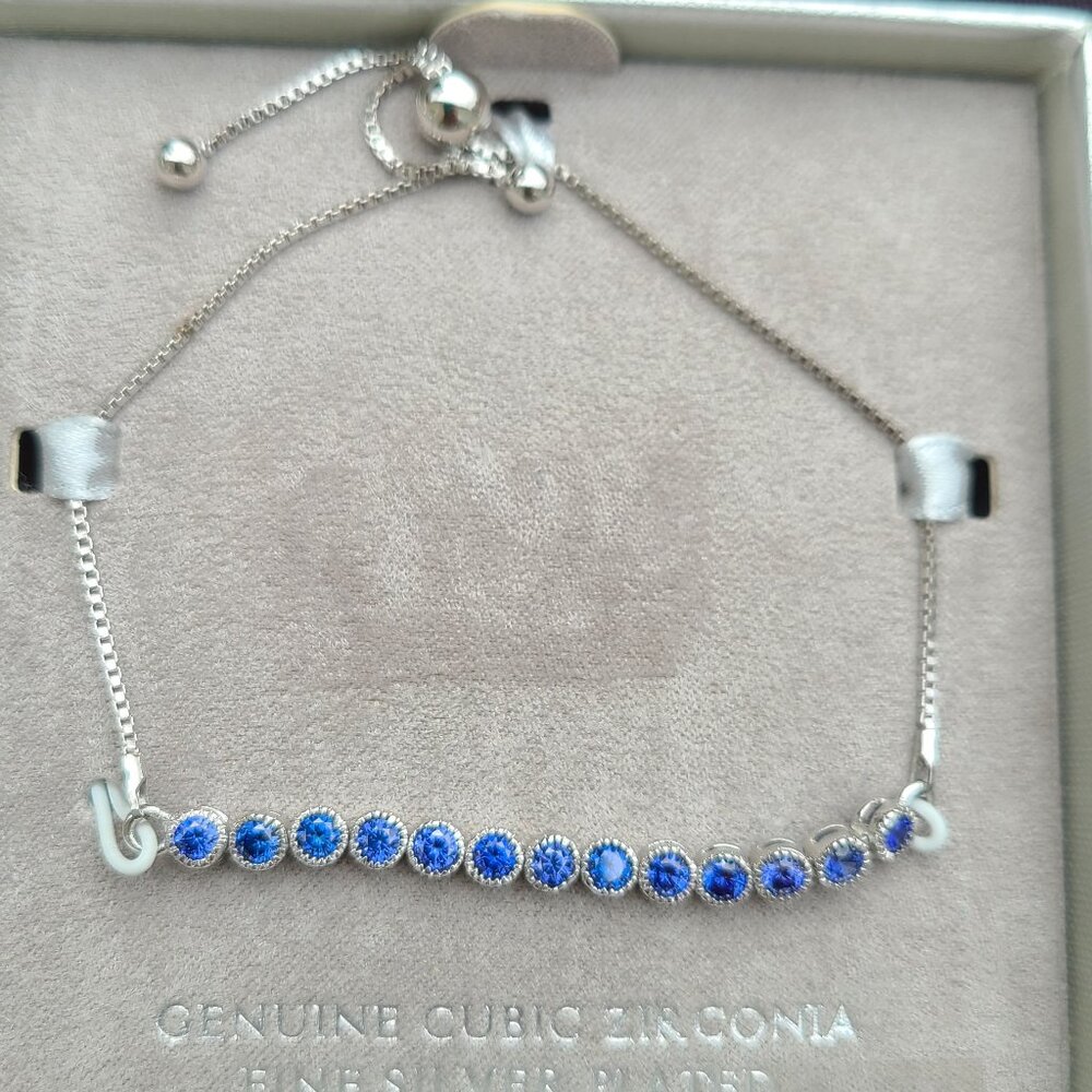 NWT expendable Bracelet: Genuine Cubic Zirconia on Fine Silver plated chain.